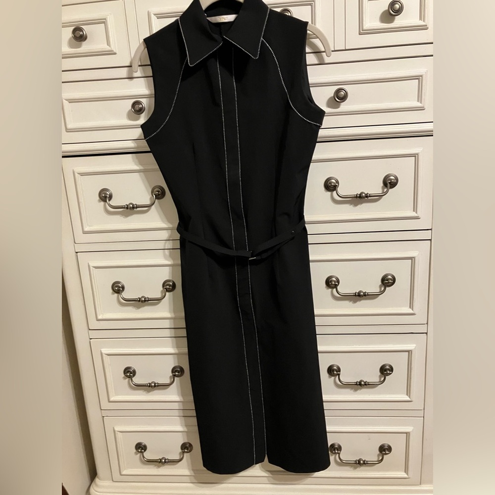 Black casual dress w/white stitching. Used excellent condition. Size small.